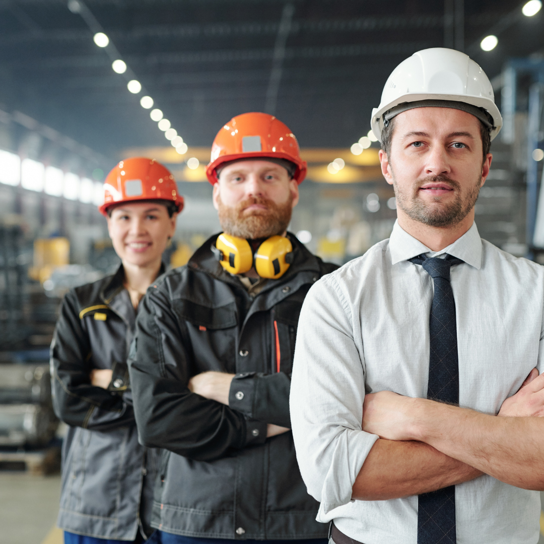 Image of two production workers at a pharmaceutical manufacturing plant.